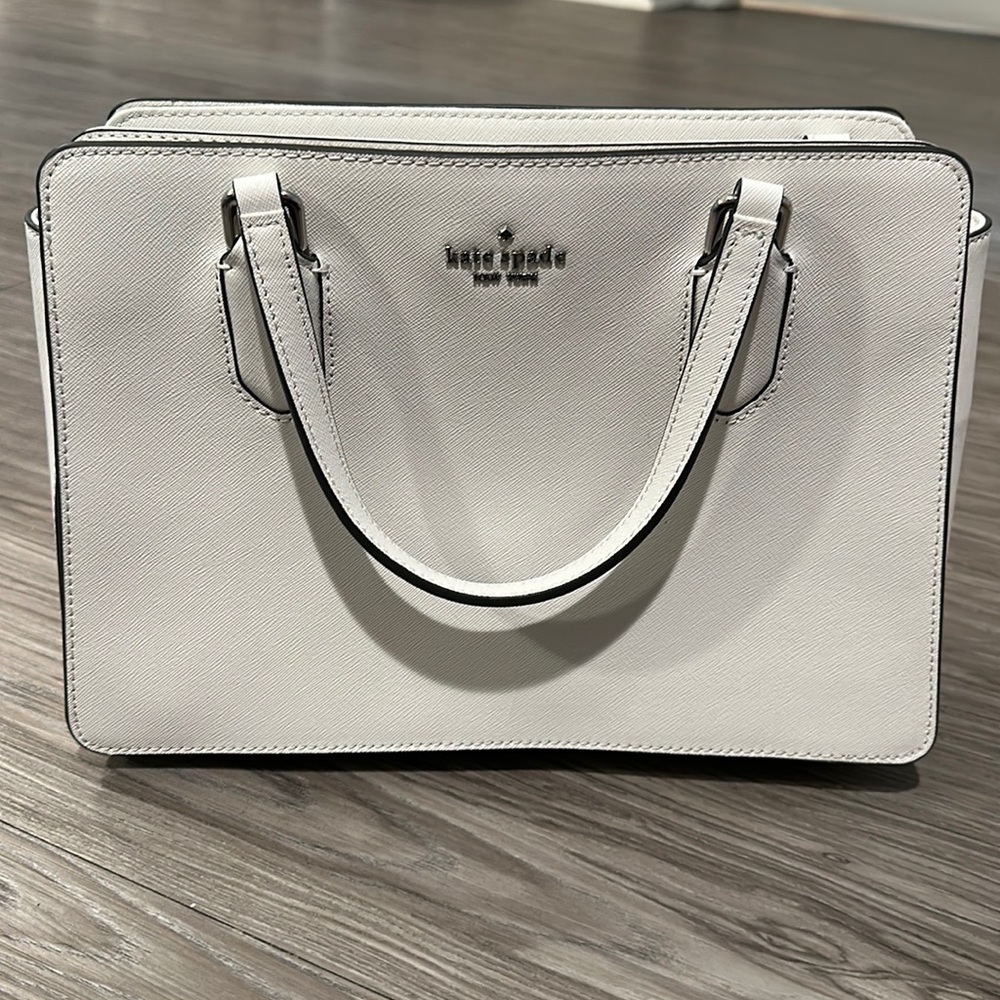Brand new and never used Kate Spade Satchel with crossbody strap